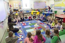 CIrcle of students listening to teacher