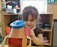 Kid playing with potato head